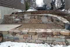 Installation by Sahin Stonework - Wall Stone:  Mix of granite and LandCare's Chestnut Hill Wall